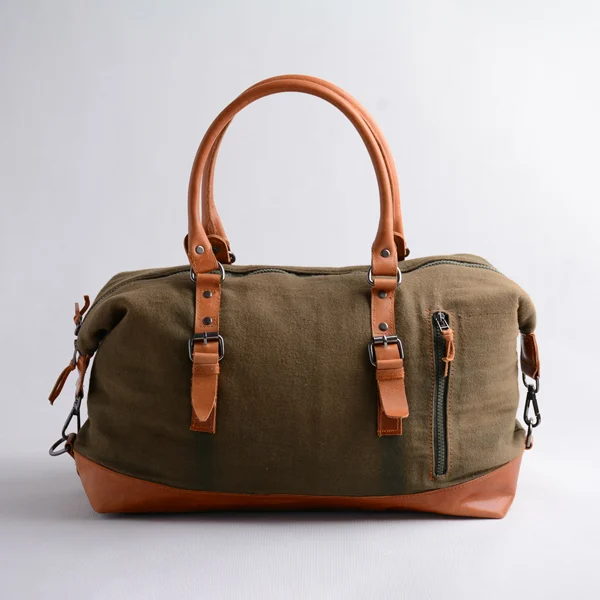 چمدان-آلپ---03 کیف مسافرتی برزنتی با طراحی جادار و جیب خارجی زیپدار